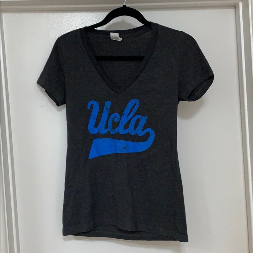 Women’s UCLA v-neck top size M-runs small